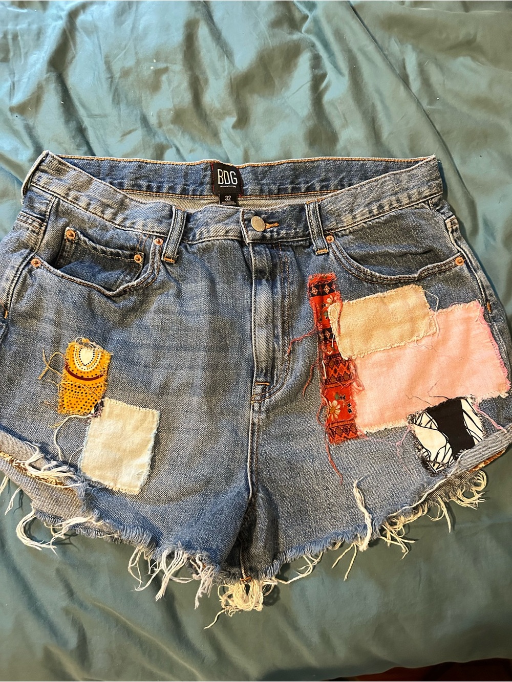 BDG Blue Denim Patchwork Frayed Hem Shorts with Pink & Yellow Accents